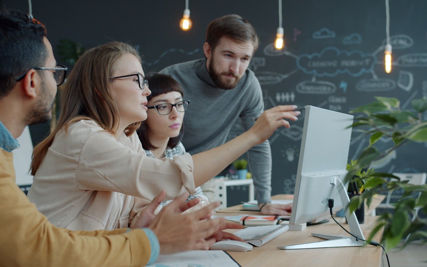Team reviewing the results of a cybersecurity audit on a screen